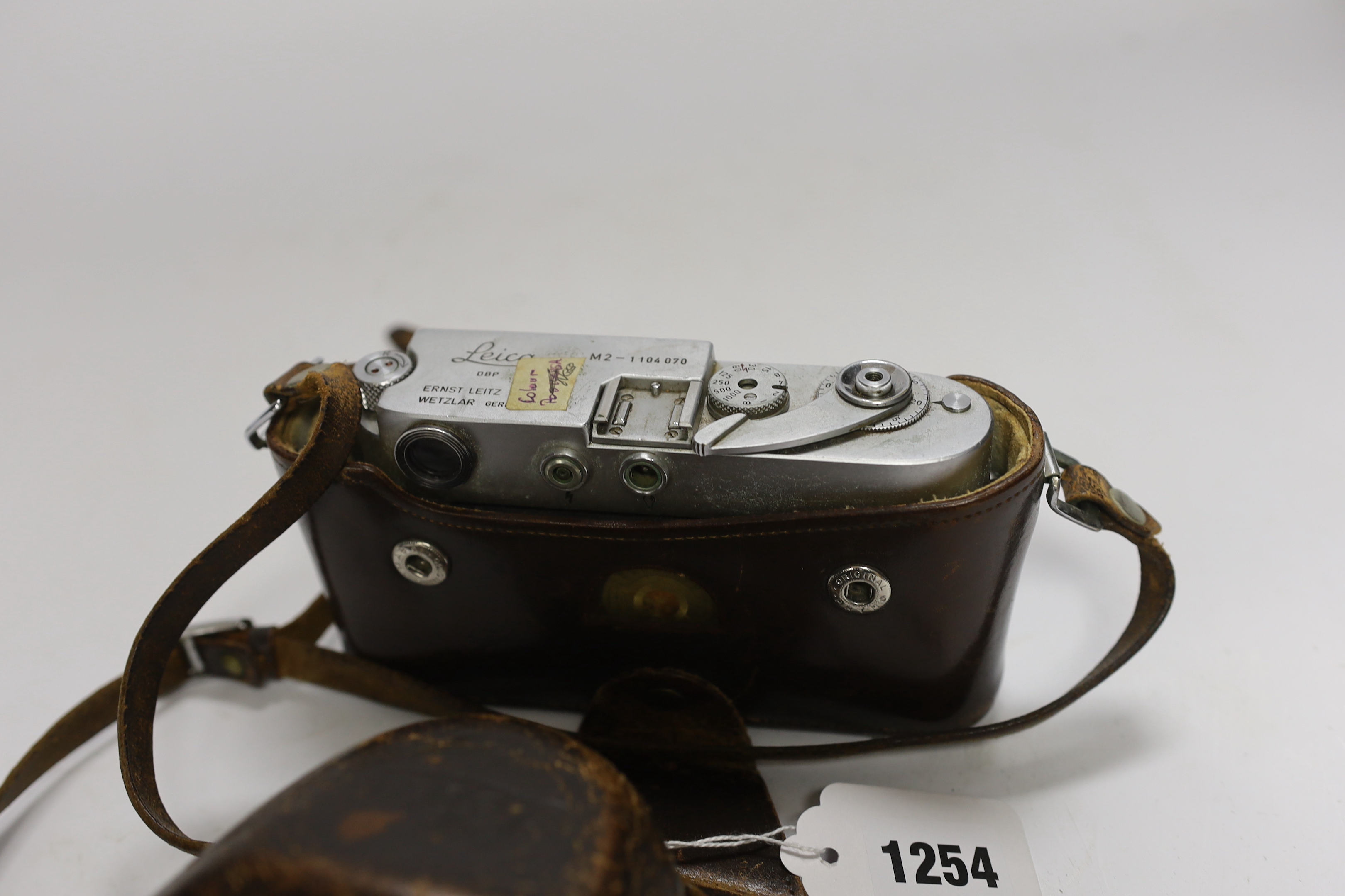 A Leica M2 camera, serial no. 1104070, c.1965, with Summaron f=3.5cm 1:3.5 lens, with leather case and strap